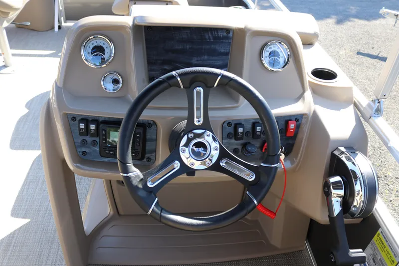 Slide: The Image of Steering console of 2025 SunChaser Vista 18 Fish boat with modern controls and gauges. - 4