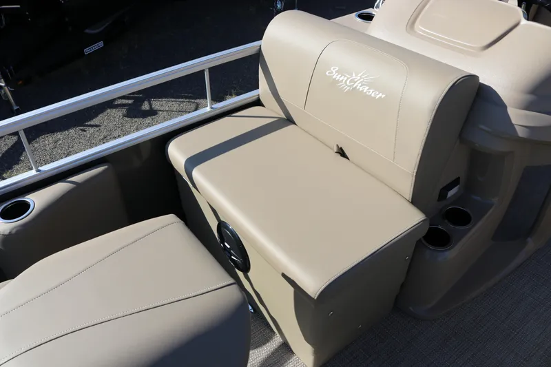 Slide: The Image of 2025 SunChaser Vista 18 Fish boat interior with beige seating and cup holders. - 7