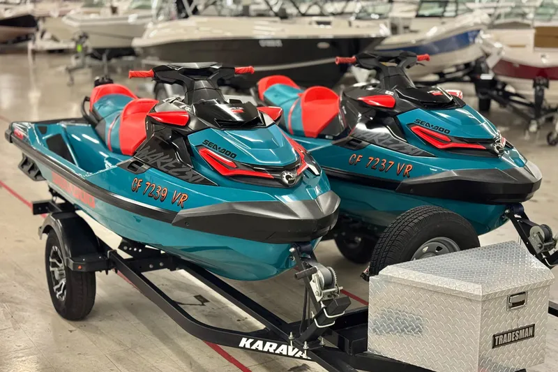 The Image of 2018 Sea-Doo Wake Pro 230 jet skis on trailer in showroom. - 0