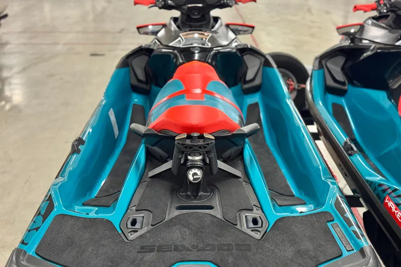 Slide: The Image of 2018 Sea-Doo Wake Pro 230 jet ski with vibrant red and blue seating. - 18