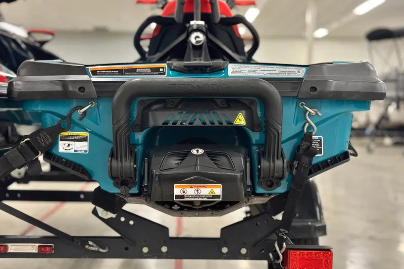 Slide: The Image of 2018 Sea-Doo Wake Pro 230 rear view, showcasing tow hooks and safety labels. - 7