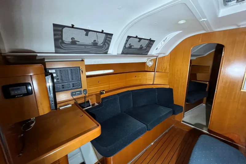 Slide: The Image of Interior of 1999 Beneteau First 42s7 yacht with wooden finish and seating area. - 11