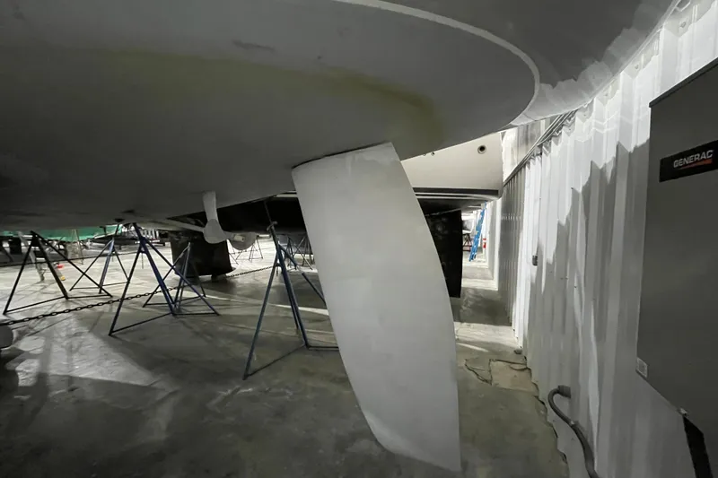 Slide: The Image of Beneteau First 42s7 sailboat keel and rudder in dry dock, 1999 model. - 4