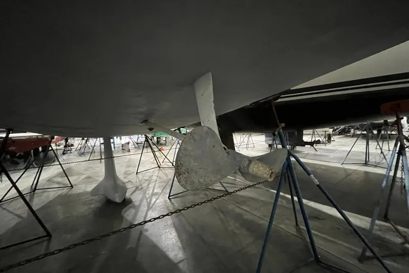 Slide: The Image of Underwater view of a 1999 Beneteau First 42s7 sailboat propeller in dry dock. - 5