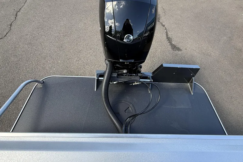 Slide: The Image of Rear view of 2025 Alumaweld Stryker X202 boat with outboard motor. - 10