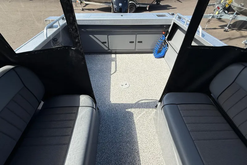 Slide: The Image of Interior of 2025 Alumaweld Stryker X202 boat with seating and storage compartments. - 11