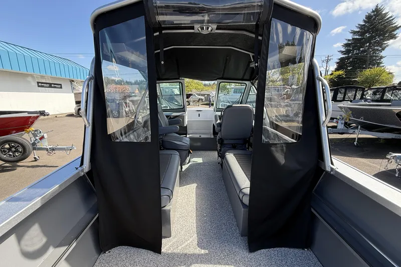 Slide: The Image of Interior view of 2025 Alumaweld Stryker X202 boat, showcasing seating and cabin design. - 17