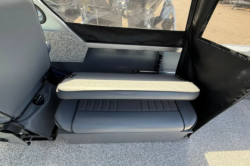 Slide: The Image of Interior seating of 2025 Alumaweld Stryker X202 boat, featuring gray upholstery and modern design. - 26