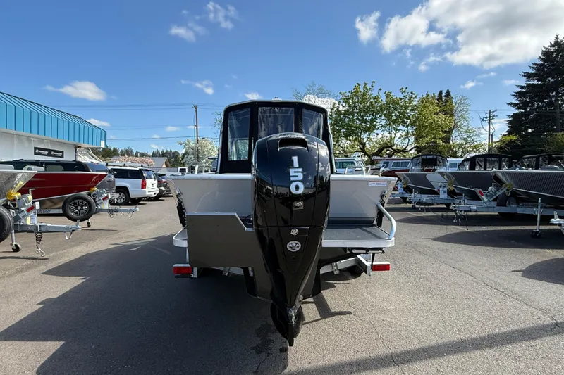 Slide: The Image of 2025 Alumaweld Stryker X202 boat with 150 HP engine in a dealership lot. - 3