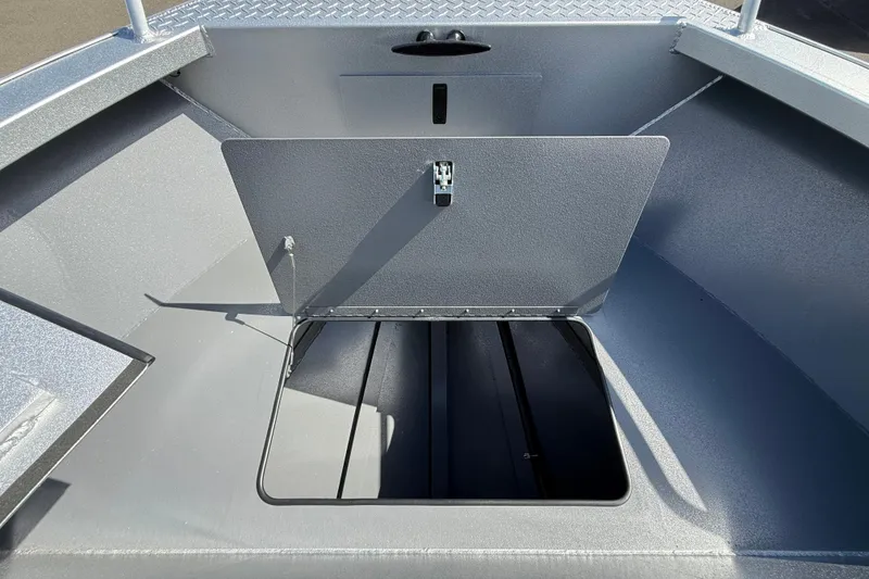 Slide: The Image of 2025 Alumaweld Stryker X202 boat storage compartment with open hatch, showcasing interior space. - 30