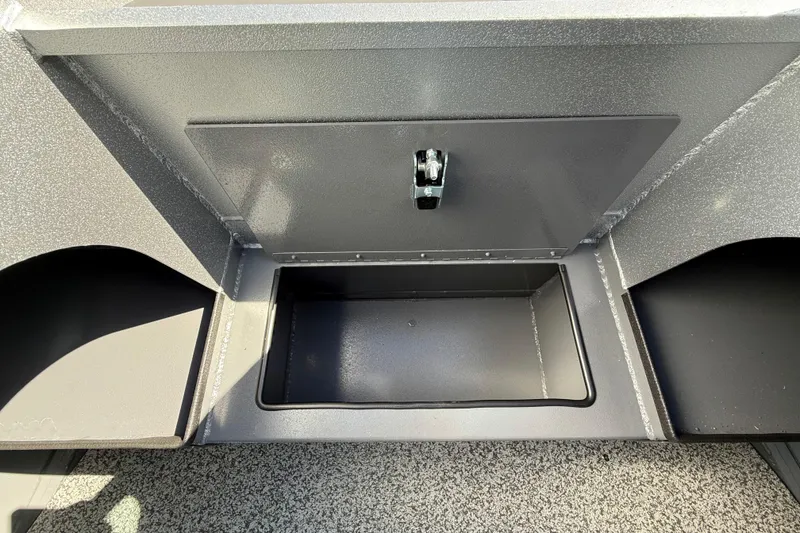 Slide: The Image of Storage compartment of 2025 Alumaweld Stryker X202 boat, featuring a secure latch. - 31
