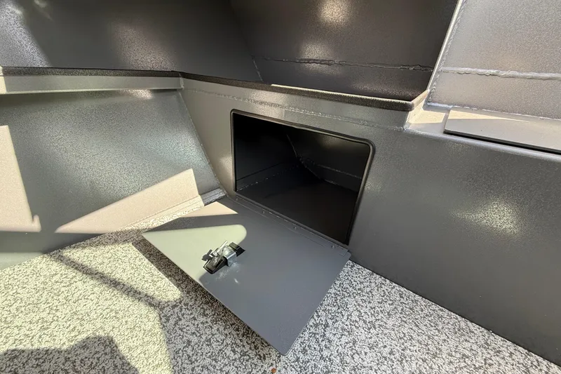 Slide: The Image of Storage compartment in 2025 Alumaweld Stryker X202 boat, featuring a secure latch. - 34