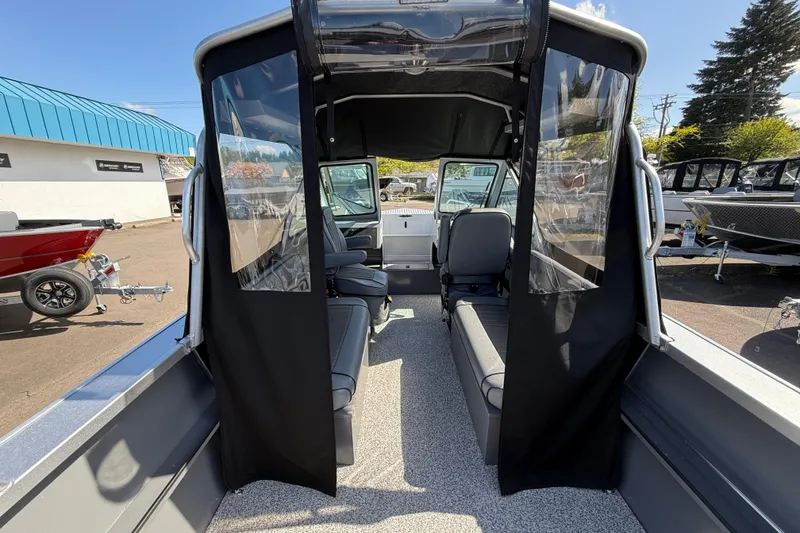 Slide: The Image of 2025 Alumaweld Stryker X202 boat interior with seating and clear side panels. - 36