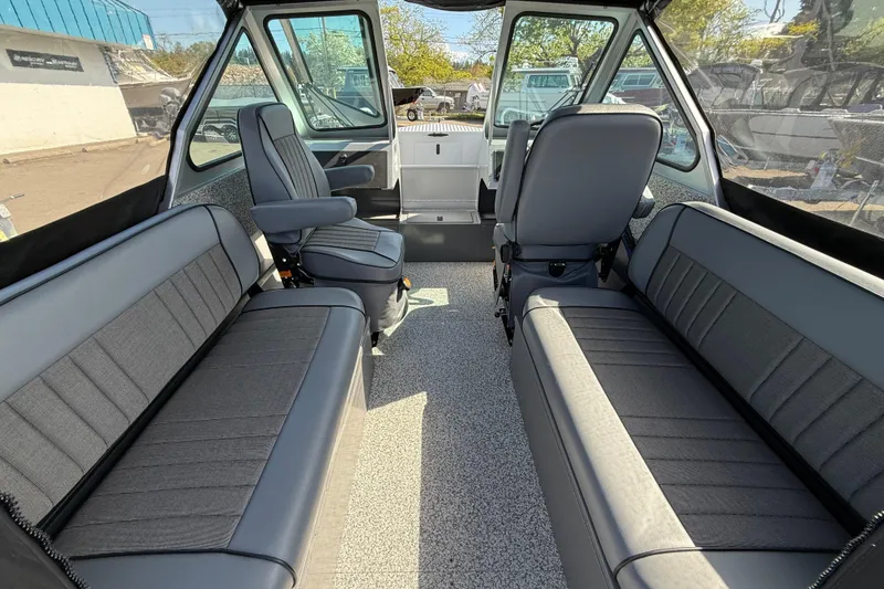 Slide: The Image of Interior of 2025 Alumaweld Stryker X202 boat with spacious seating and modern design. - 37