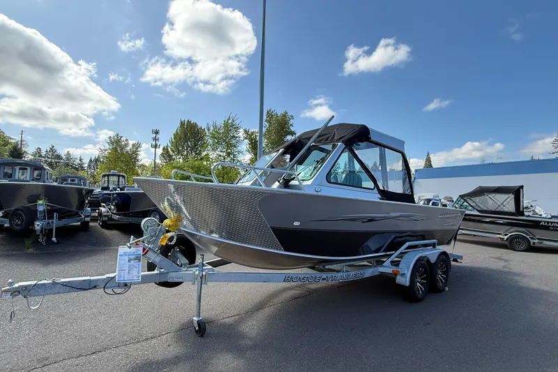 Slide: The Image of 2025 Alumaweld Stryker X202 boat on trailer under blue sky. - 7