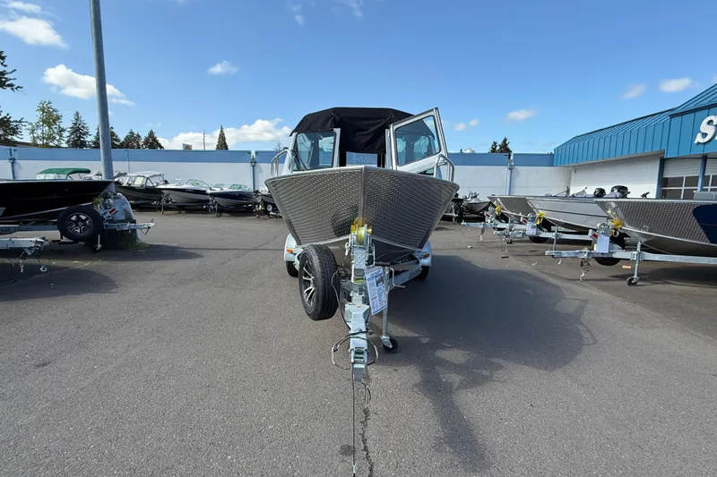 Slide: The Image of 2025 Alumaweld Stryker X202 boat on trailer in dealership lot. - 8