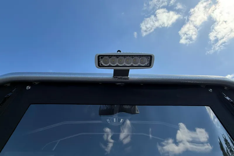 Slide: The Image of 2025 Alumaweld Stryker X202 boat with LED light bar against blue sky. - 9