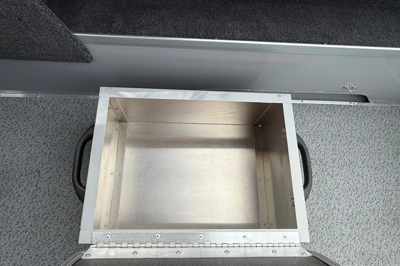 Slide: The Image of Open storage compartment in 2025 Smoker Craft Osprey 162 boat interior. - 12