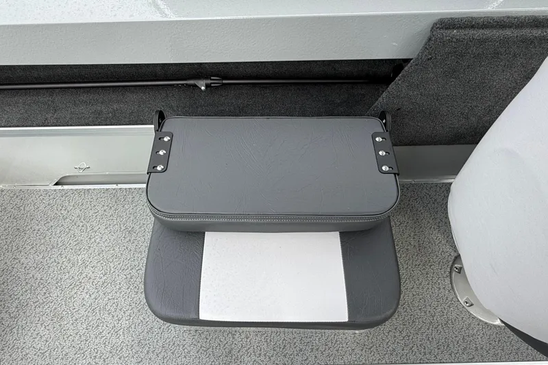 Slide: The Image of 2025 Smoker Craft Osprey 162 boat interior with gray seating and carpeted flooring. - 16