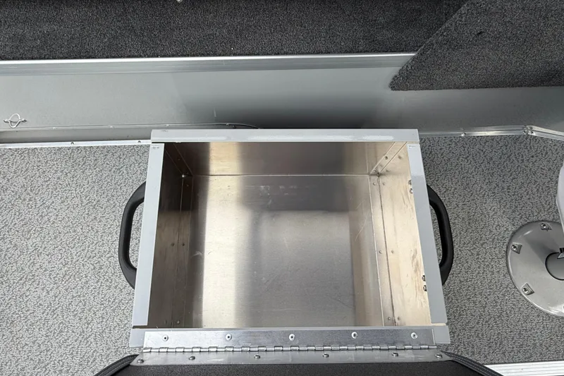 Slide: The Image of 2025 Smoker Craft Osprey 162 boat interior with open storage compartment. - 17