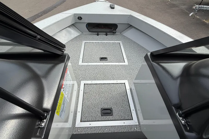 Slide: The Image of 2025 Smoker Craft Osprey 162 boat interior with storage compartments and sleek design. - 19