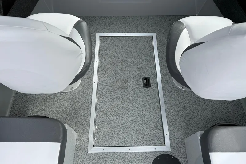 Slide: The Image of 2025 Smoker Craft Osprey 162 interior with gray carpet and white seats. - 20