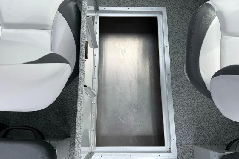 Slide: The Image of Interior view of 2025 Smoker Craft Osprey 162 boat with storage compartment. - 21