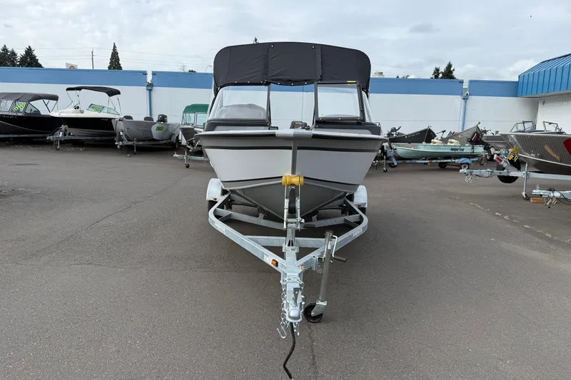 Slide: The Image of 2025 Smoker Craft Osprey 162 boat on trailer in dealership lot. - 29