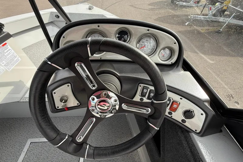 Slide: The Image of Steering console of 2025 Smoker Craft Osprey 162 boat with gauges and controls. - 5