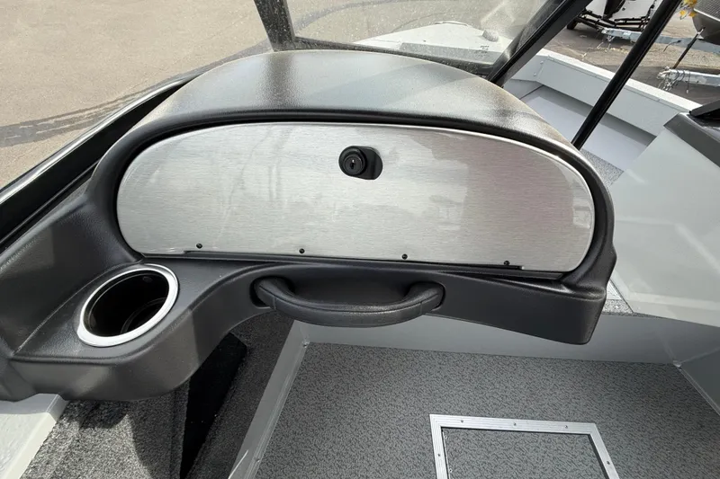 Slide: The Image of 2025 Smoker Craft Osprey 162 boat interior with glove compartment and cup holder. - 6
