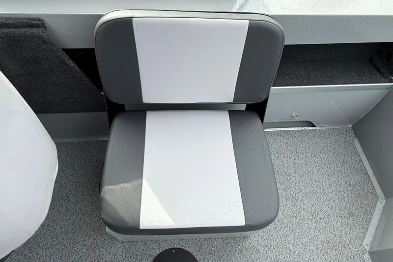 Slide: The Image of 2025 Smoker Craft Osprey 162 boat seat, gray and white upholstery, interior view. - 7