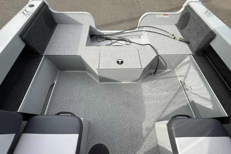 Slide: The Image of Interior view of 2025 Smoker Craft Osprey 162 boat, featuring spacious seating and storage. - 9