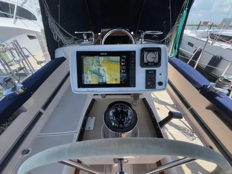 Slide: The Image of Cockpit of 1995 Island Packet 37 sailboat with navigation equipment and compass. - 18
