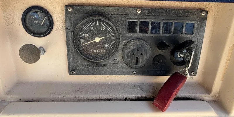 Slide: The Image of Control panel of a 1995 Island Packet 37 sailboat with gauges and ignition key. - 22
