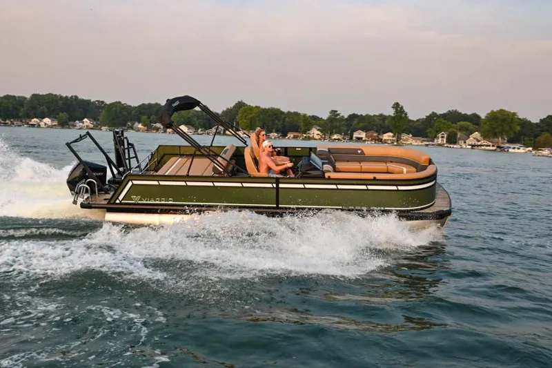Slide: The Image of Manufacturer Provided Image: 2024 Viaggio Lago X-S pontoon boat cruising on a lake. - 10