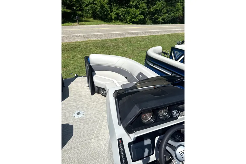 Slide: The Image of 2024 Viaggio Lago X-S boat interior with sleek seating and modern dashboard design. - 2