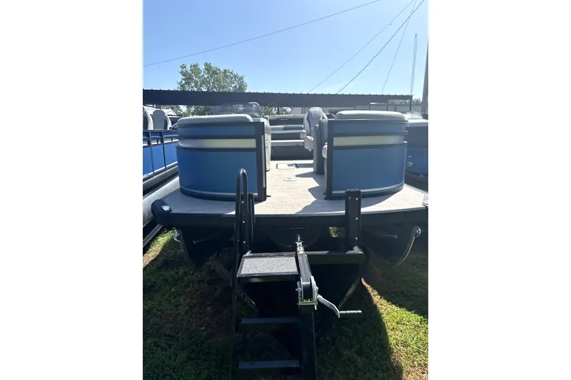 Slide: The Image of 2024 Viaggio Lago X-S pontoon boat with blue seating and trailer. - 7