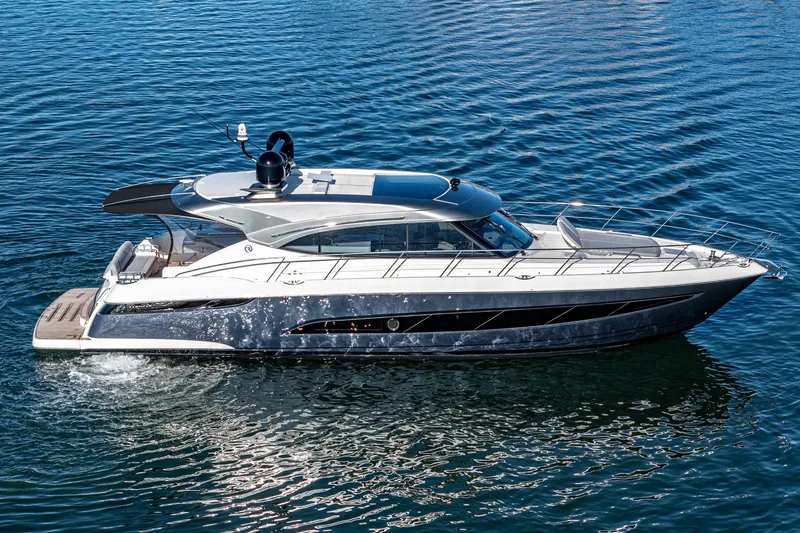 Slide: The Image of 2024 Riviera 5400 Sport Yacht cruising on water. - 10