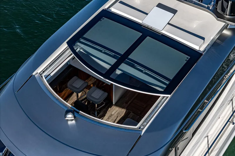 Slide: The Image of Aerial view of 2024 Riviera 5400 Sport Yacht's sleek design and spacious deck. - 18