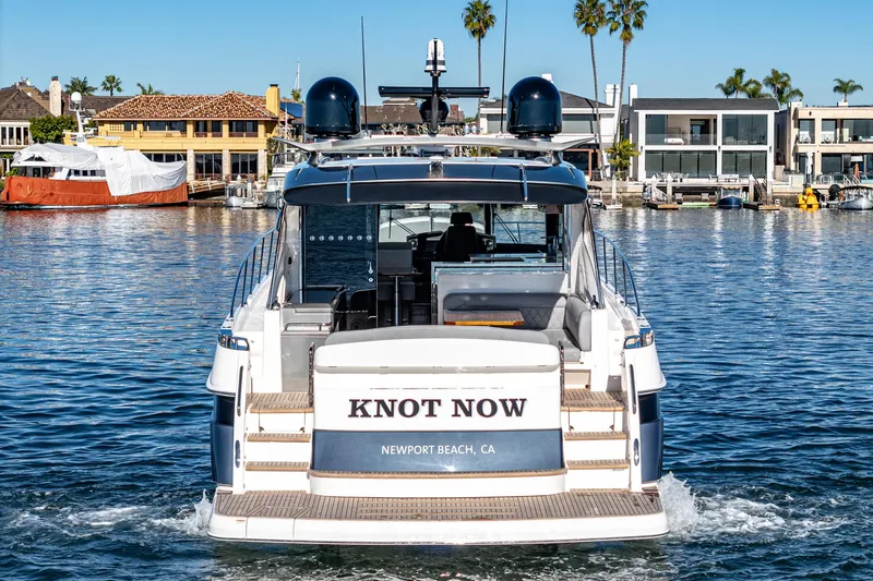 Slide: The Image of 2024 Riviera 5400 Sport Yacht in Newport Beach, CA, rear view. - 20