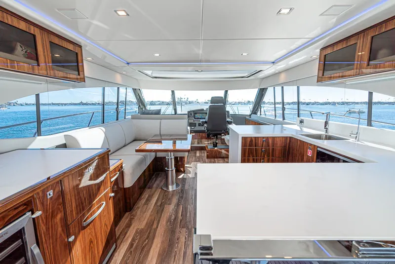 Slide: The Image of Luxurious interior of 2024 Riviera 5400 Sport Yacht with modern kitchen and seating area. - 29