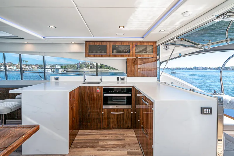 Slide: The Image of Modern kitchen interior of 2024 Riviera 5400 Sport Yacht with ocean view. - 30