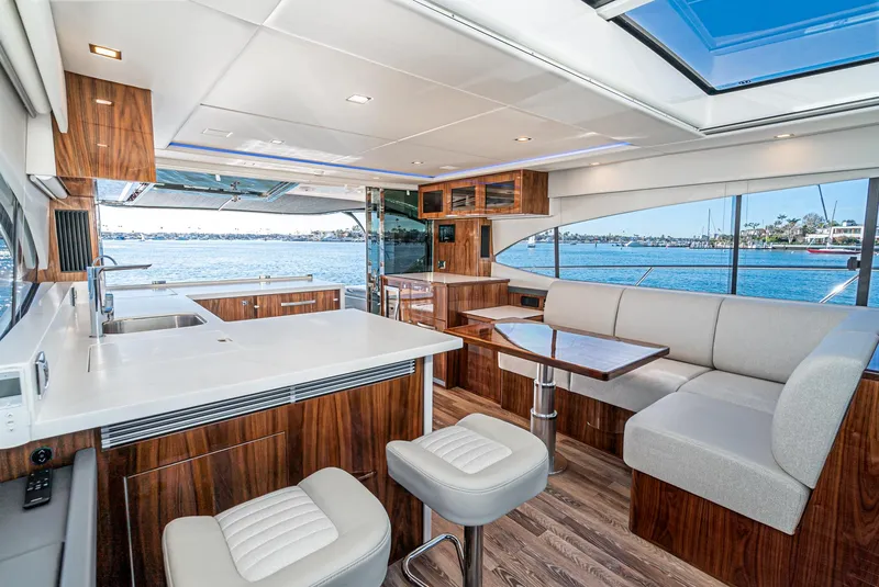 Slide: The Image of Luxurious interior of the 2024 Riviera 5400 Sport Yacht with modern furnishings and ocean view. - 32