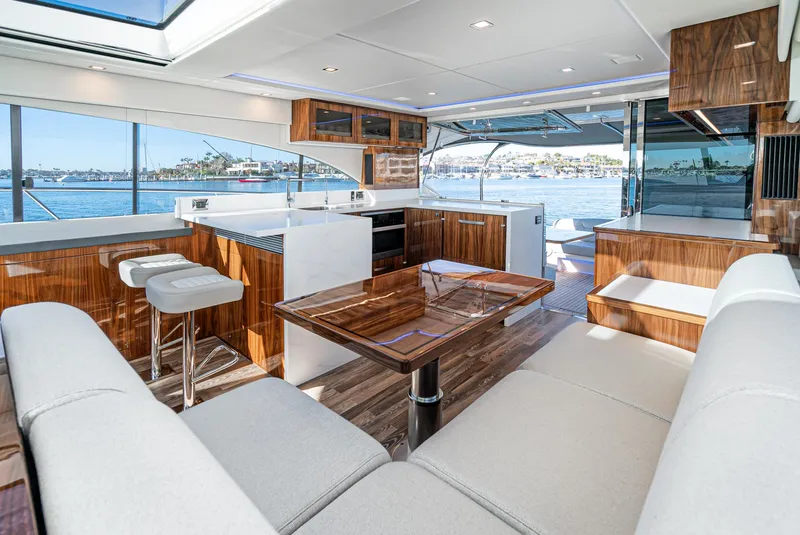Slide: The Image of Luxurious interior of the 2024 Riviera 5400 Sport Yacht with modern furnishings and ocean view. - 33