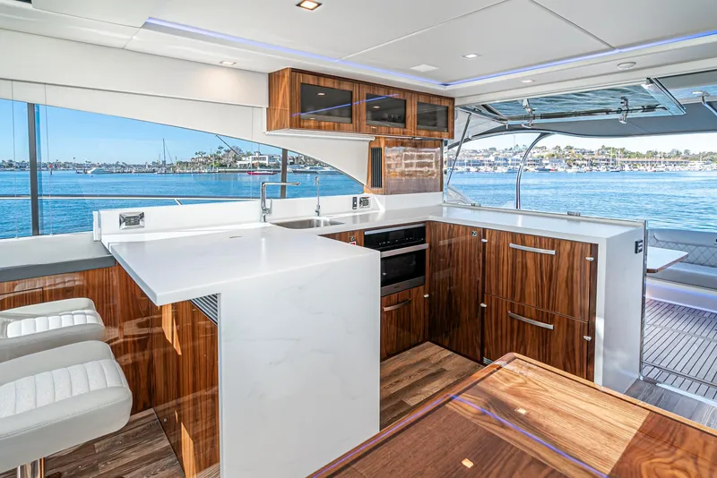 Slide: The Image of Modern kitchen interior of 2024 Riviera 5400 Sport Yacht with ocean view. - 34
