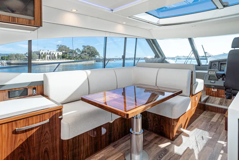 Slide: The Image of Luxurious interior of the 2024 Riviera 5400 Sport Yacht with panoramic windows and elegant wood finishes. - 39