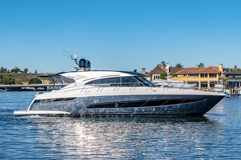 Slide: The Image of 2024 Riviera 5400 Sport Yacht cruising on a sunny day. - 9