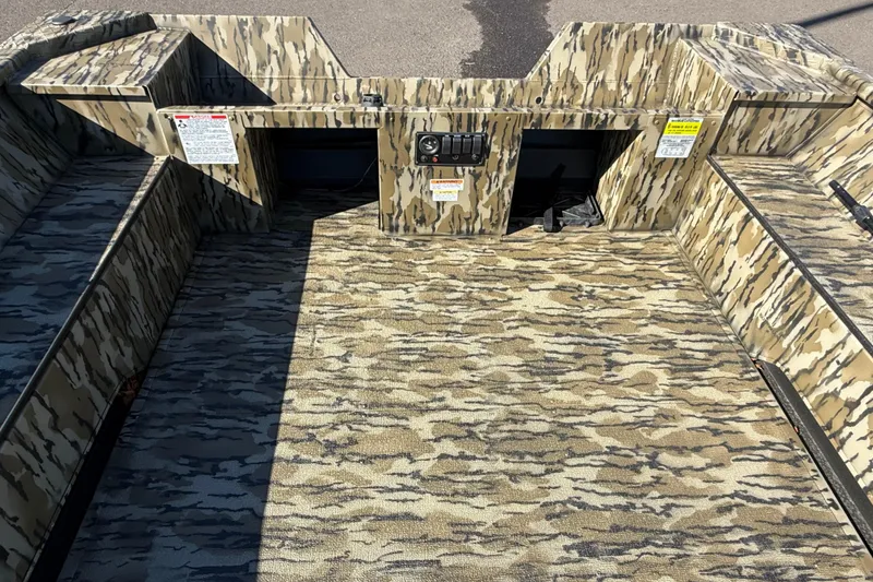 Slide: The Image of 2025 Smoker Craft Sportsman 1866 boat interior with camouflage design. - 13