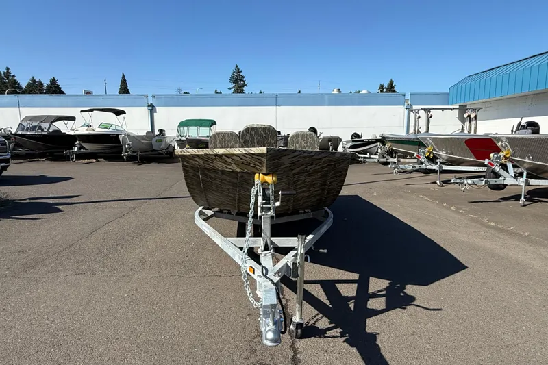 Slide: The Image of 2025 Smoker Craft Sportsman 1866 boat on trailer in outdoor showroom. - 4