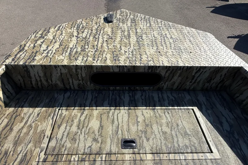 Slide: The Image of 2025 Smoker Craft Sportsman 1866 boat with camouflage pattern and storage compartment. - 9